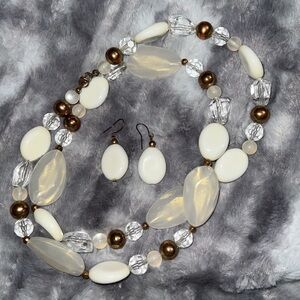 Long, beaded pearl and gold colored necklace w/ earrings